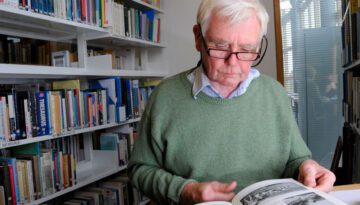 Picture of a student reading a book