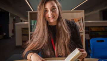 Picture of student reading a book