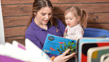 children-young-people-banner-960x500 Picture of a student reading to a child